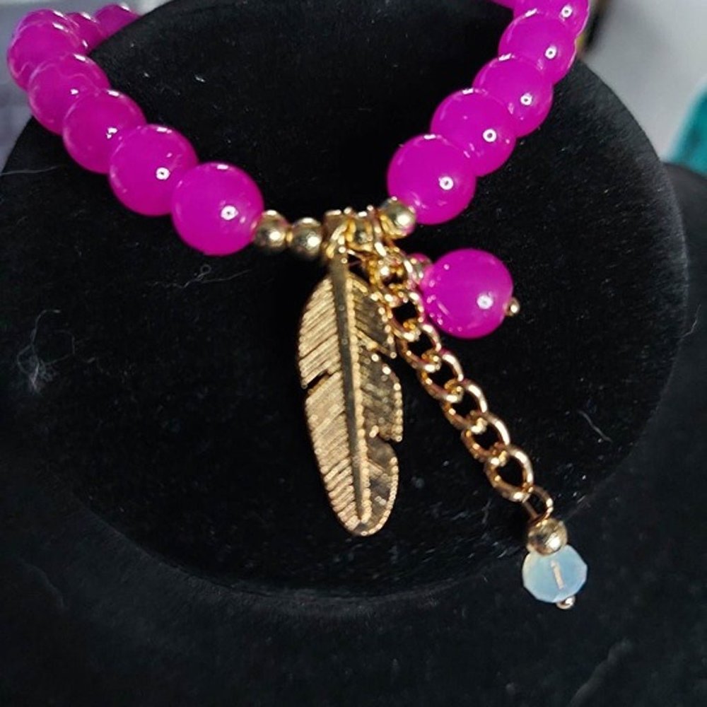 Pink Bracelet with feather charm